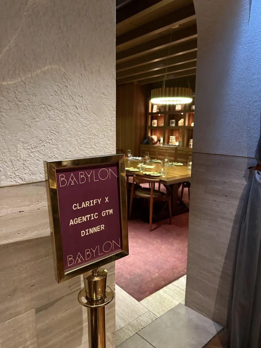 Sign reading “Clarify × Agentic GTM Dinner” at the entrance to a private dining room
